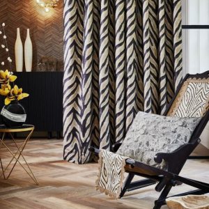 Tela estampada para cortinas con collage de animales – Zambezi Raven